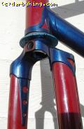 Head lug, fork crown, and blade stiffener with cut-outs